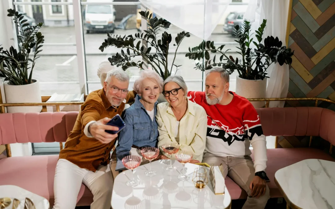 Group of four adults taking a selfie in a restaurant